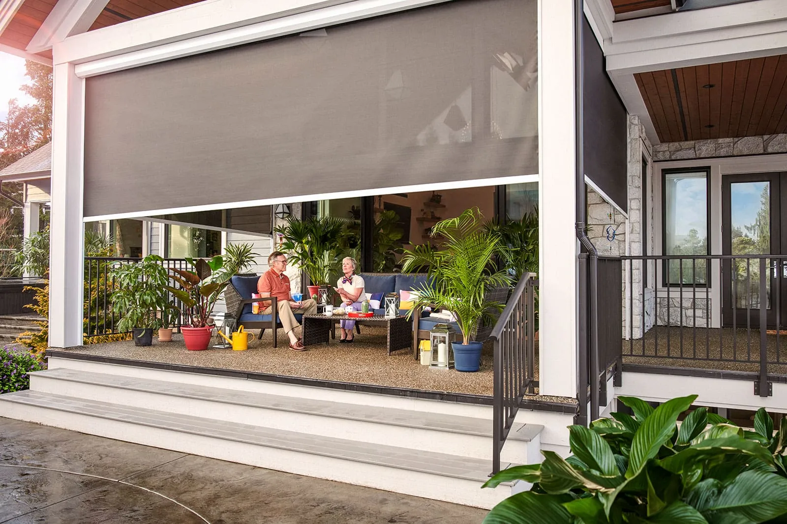 Motorized power screens enclosing an outdoor living space